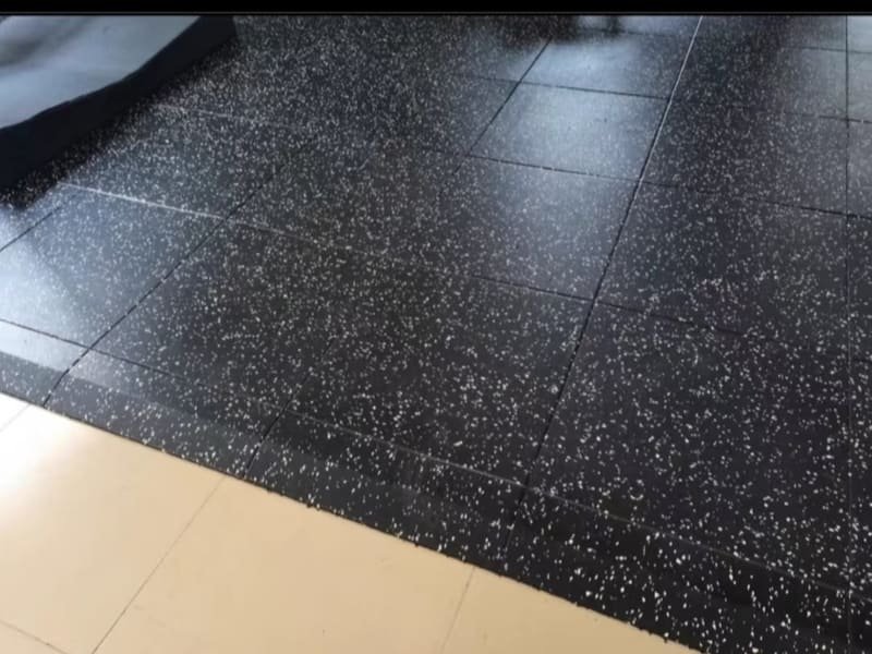 A close-up shot showing the texture and cross-section of different flooring materials